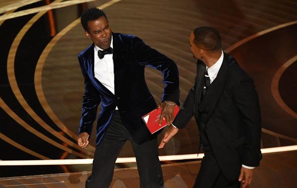 US actor Will Smith (R) slaps US actor Chris Rock onstage during the 94th Oscars at the Dolby Theatre in Hollywood, California on March 27, 2022. Robyn Beck / AFP