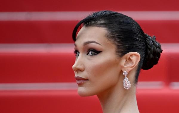 US model Bella Hadid arrives for the screening of the film "The Innocent (L'Innocent)" during the 75th edition of the Cannes Film Festival in Cannes, southern France, on May 24, 2022. (Photo by LOIC VENANCE / AFP)