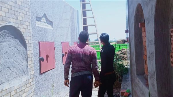 الحركة الوطنية يقوم بصيانة أعمدة الإنارة بمقابر الدقهلية