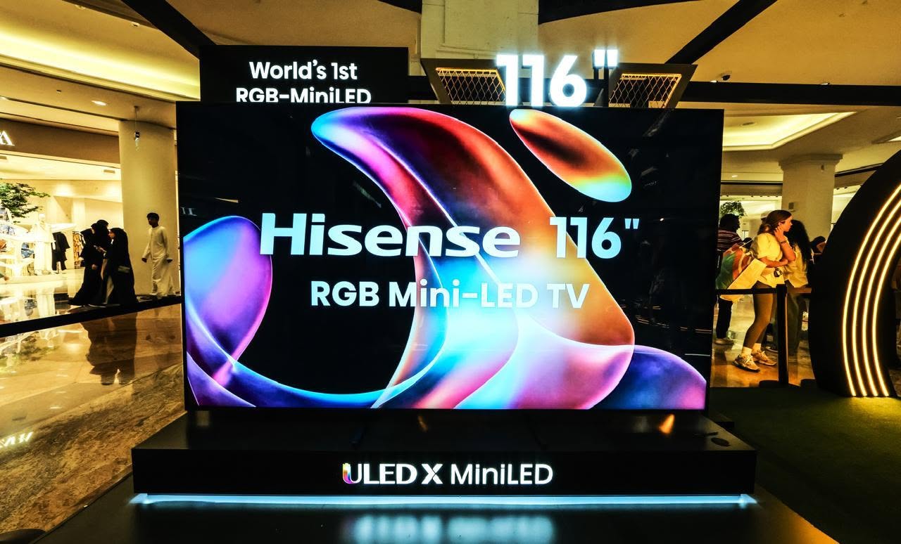May be an image of 7 people, lighting, television and text that says 'World's 1st RGB-MiniLED ED オスフータ 116 .摩 Hisense 116" RGB Mini-LED GBMini-LEDT LED TV Mini ULED ULEDXMiniLED X MiniLED'
