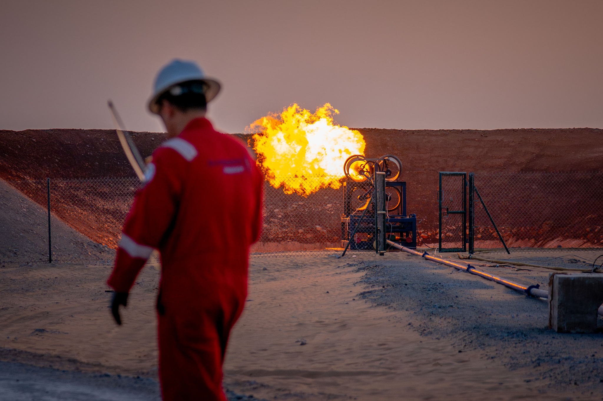 May be an image of fire and oil refinery