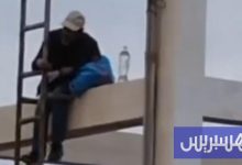 رجل يهدد بالانتحار من أعلى خزان مائي